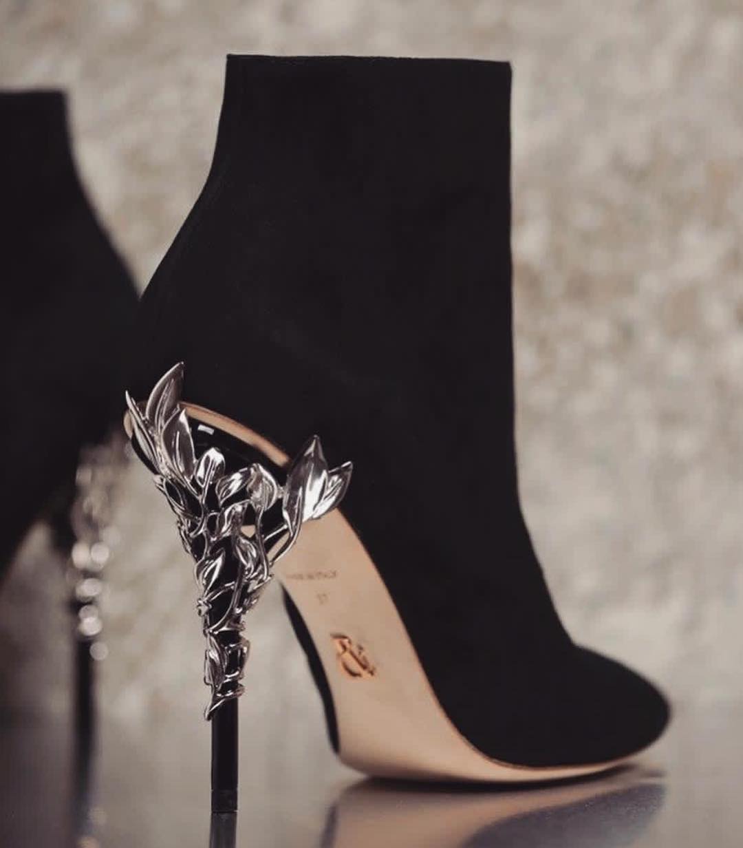 Black High Heel Women's Ankle Boot with Silver Stems.