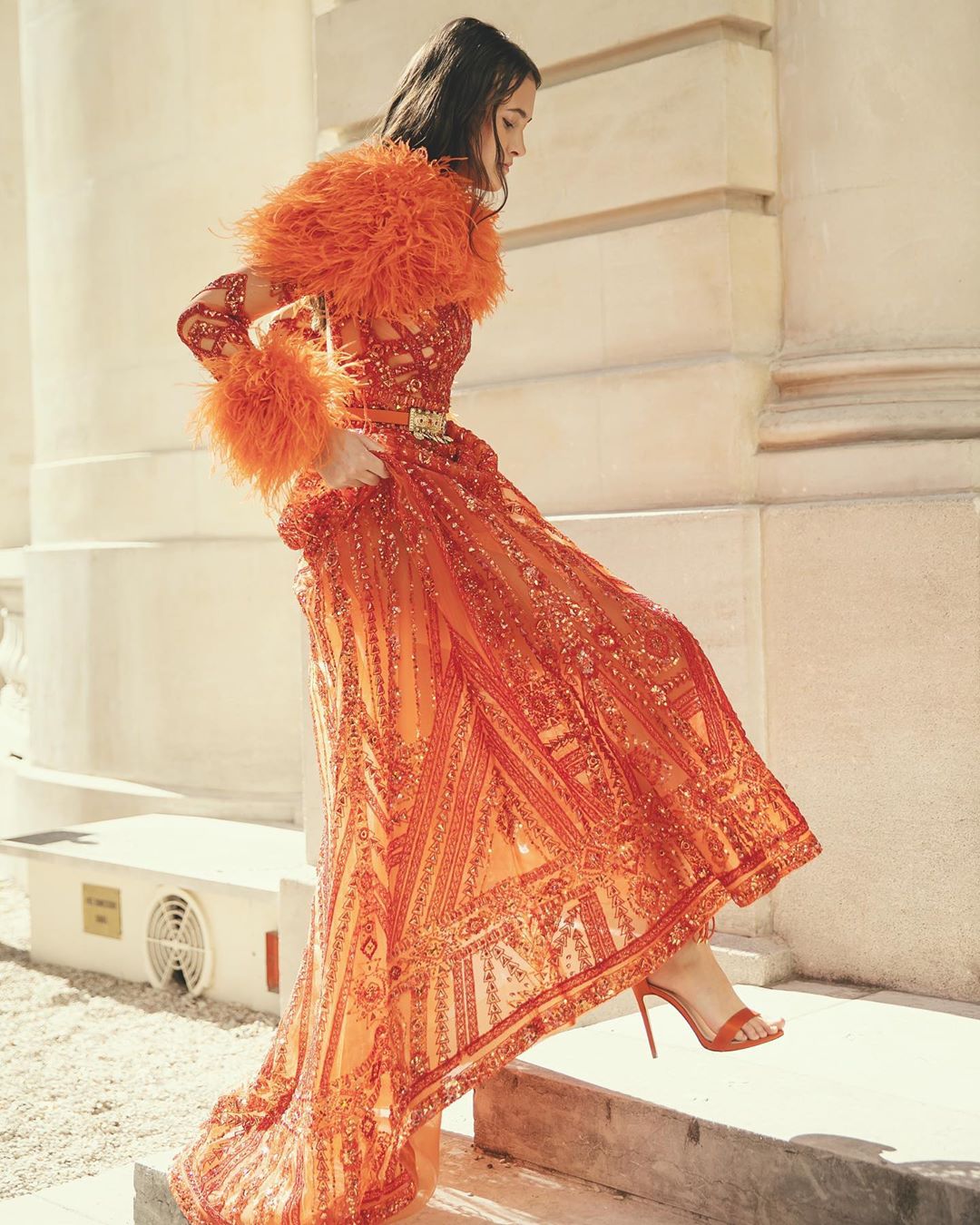 Colorful Orange Sequin Dress with Long Sleeves, Sequins and Feather Trim.