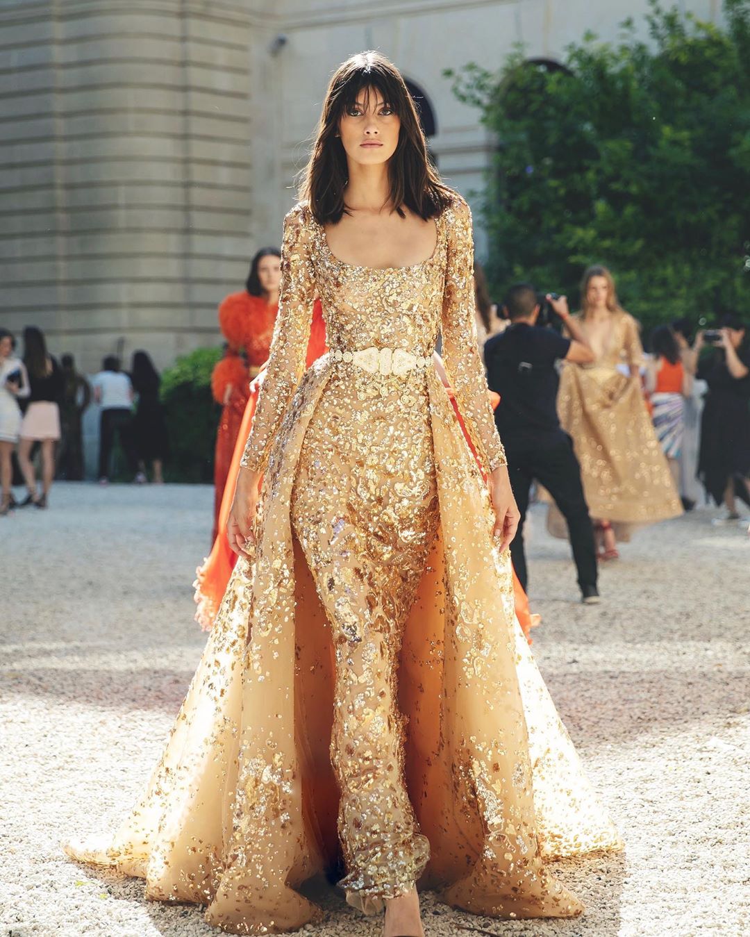 Sequin Evening Gown with Sleeves, Scoop Neck and Voluminous Skirt in Gold.