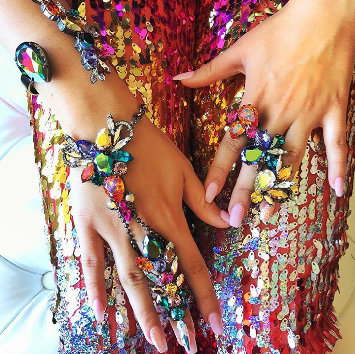 Colorful crystals on a hand