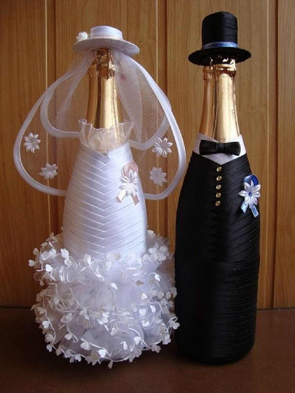 Bling wedding receptions Glittering Bride and Groom Decorated Champagne Bottles