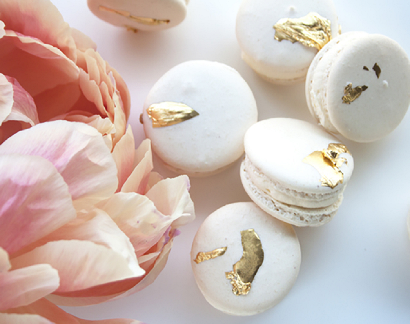 Bling wedding receptions Everyone Loves These Gold Flecked Macarons. Try Stacking Them For a Quirky Cake