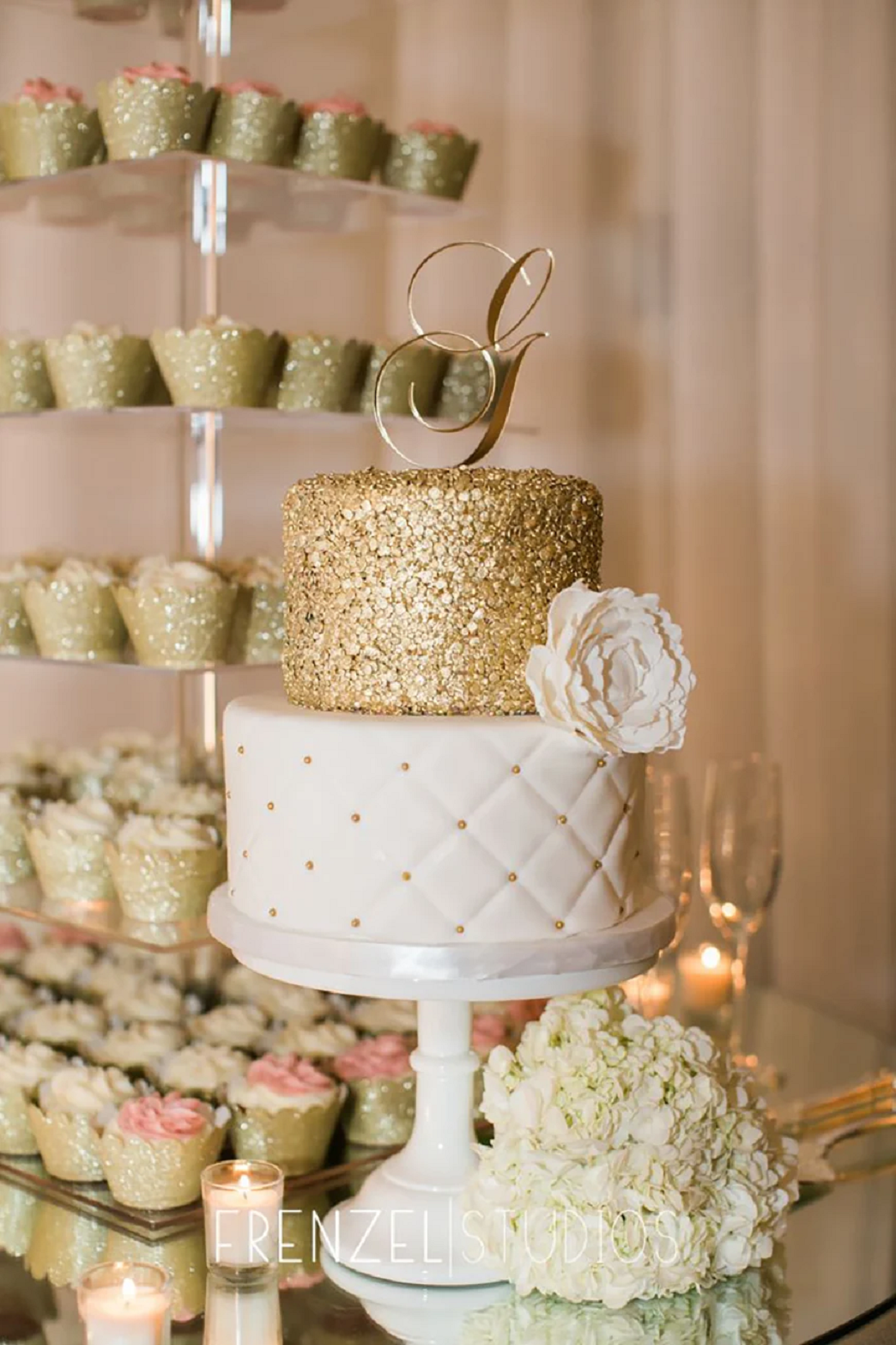 Bling wedding receptions Good Decision To Have a Gold Glittering Wedding Cake Surrounded By Pretty Cupcakes!