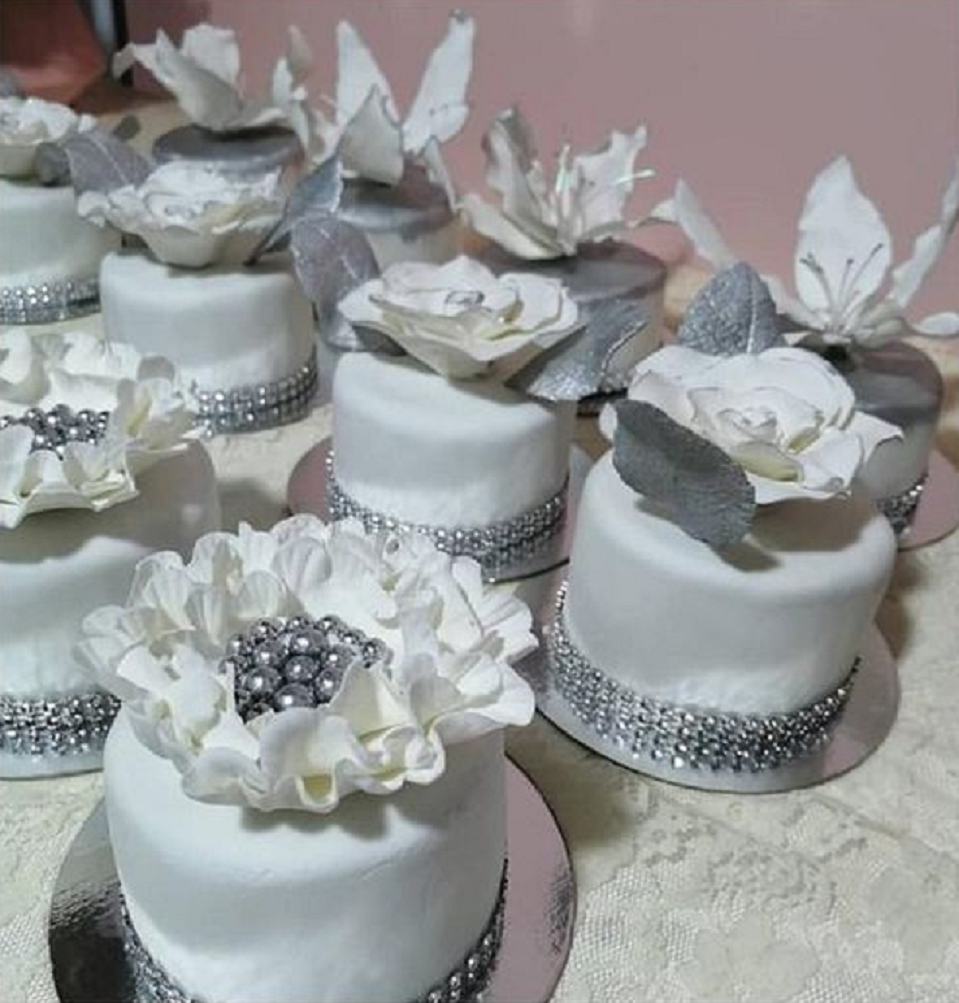 Bling wedding receptions Wedding Cake In White with A Floral Design and Rhinestone Trims