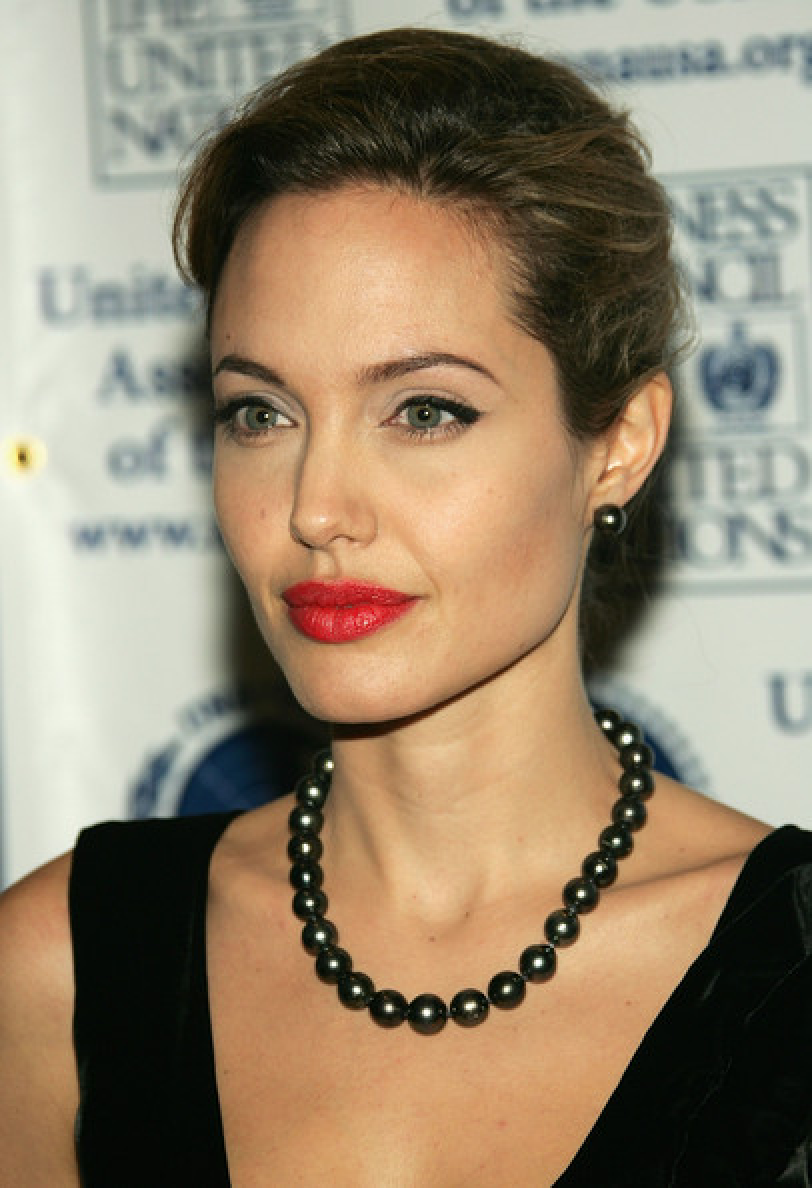 Celebrity Jewelry Angelina Jolie Wears Her Black Pearl Necklace and Earring with The Classic Bun Hair Style