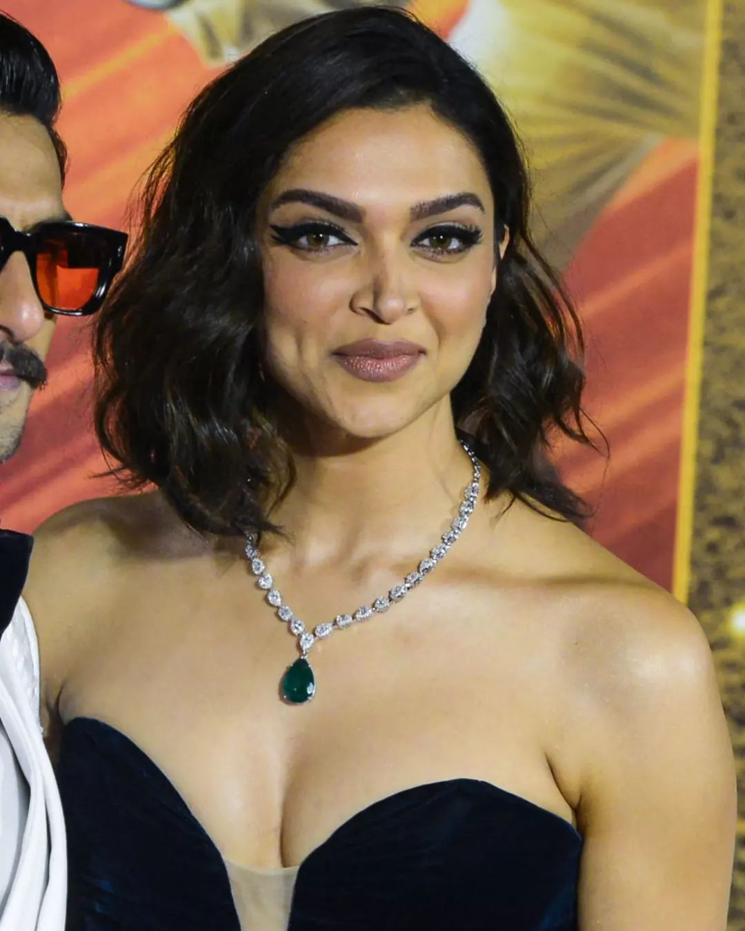 Deepika Padukone Wearing A Diamond Single Row Necklace with An Emerald Tear Drop Pendant