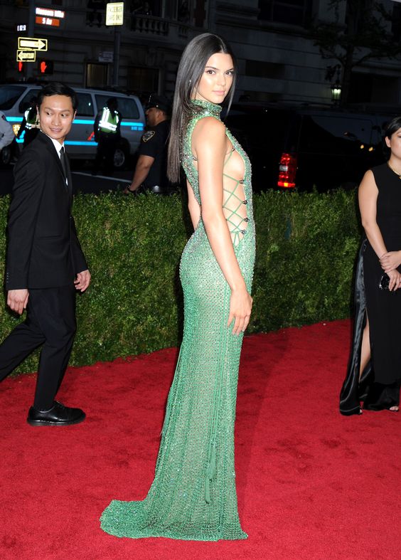 Kendall Jenner Wearing A Green Sequin Sleeveless Long Gown with a Side Tie-up.